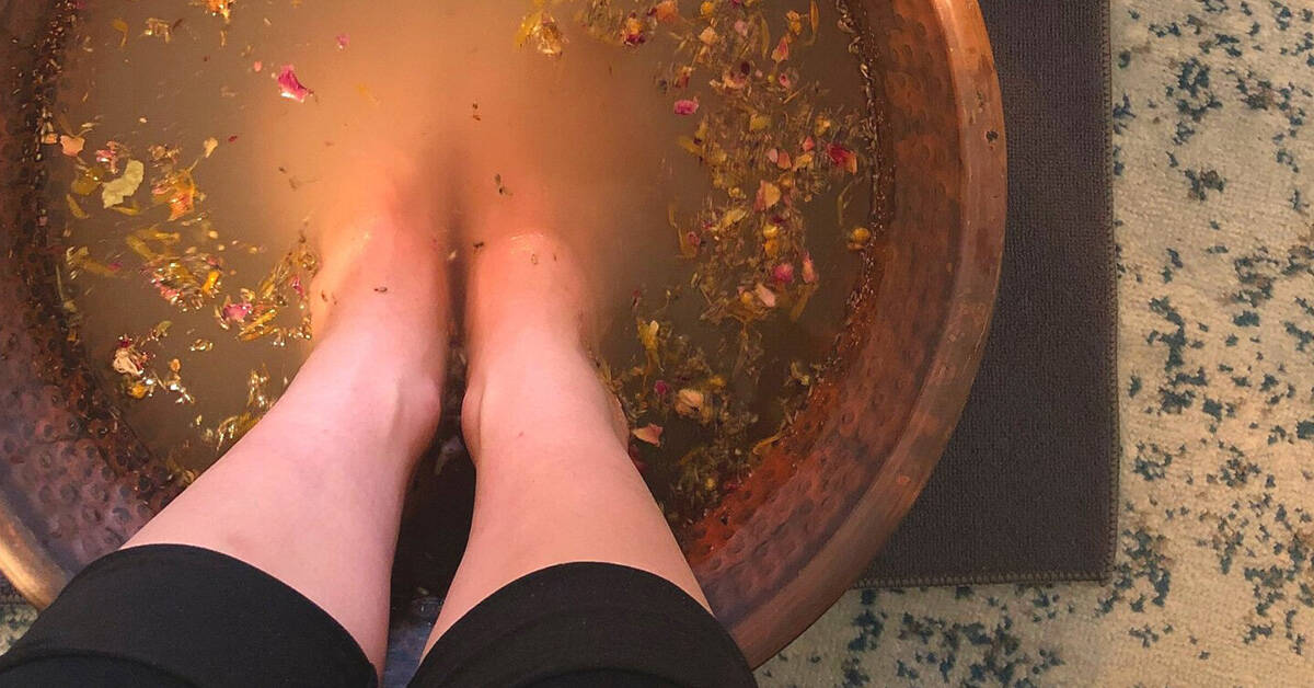 Feet in garlic foot bath